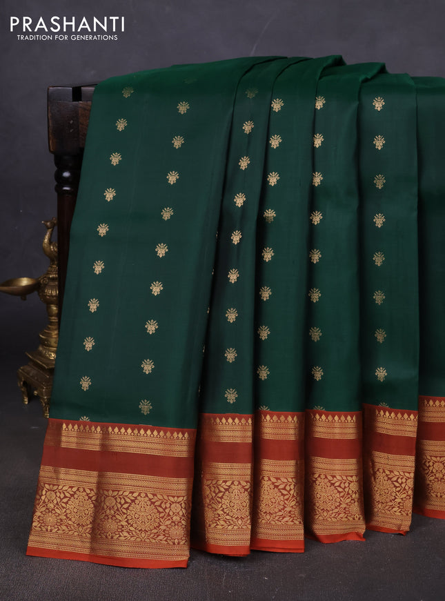 Pure soft silk saree bottle green and rustic orange with allover zari woven buttas and zari woven border