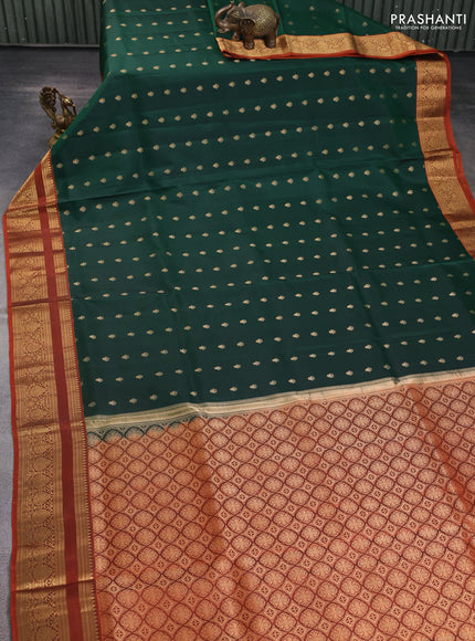 Pure soft silk saree bottle green and rustic orange with allover zari woven buttas and zari woven border