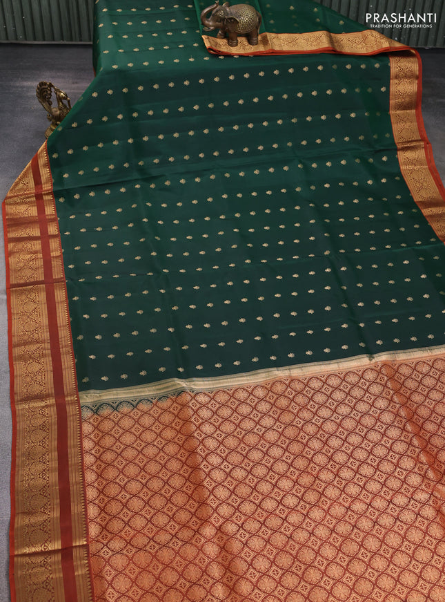 Pure soft silk saree bottle green and rustic orange with allover zari woven buttas and zari woven border