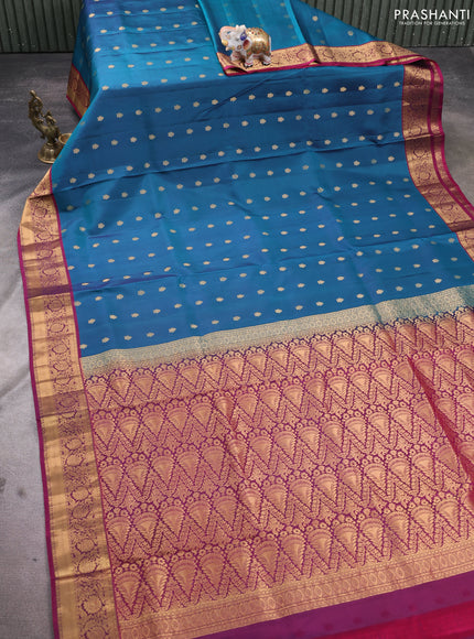 Pure soft silk saree peacock blue and dark magenta pink with allover zari woven buttas and floral zari woven border