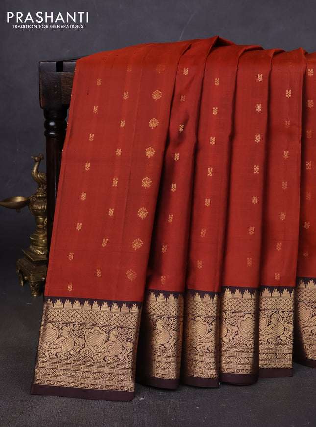 Pure soft silk saree rustic orange and coffee brown with allover zari woven buttas and annam zari woven border
