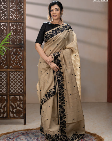 Art tussar saree beige and black with embroidery work and floral embroidery border