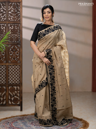 Art tussar saree beige and black with embroidery work and floral embroidery border