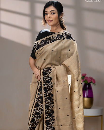 Art tussar saree beige and black with embroidery work and floral embroidery border