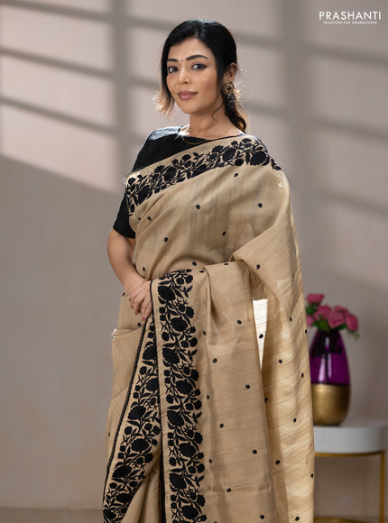 Art tussar saree beige and black with embroidery work and floral embroidery border