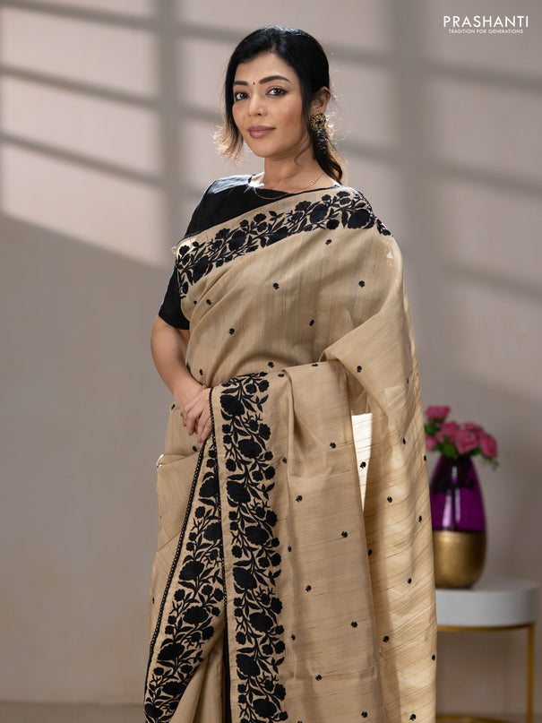 Art tussar saree beige and black with embroidery work and floral embroidery border