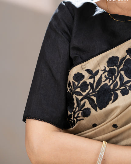 Art tussar saree beige and black with embroidery work and floral embroidery border