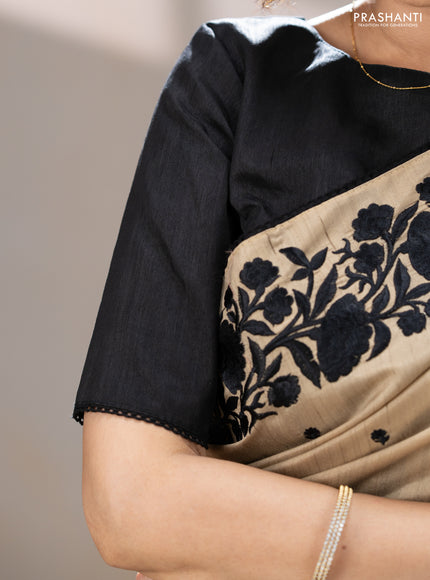 Art tussar saree beige and black with embroidery work and floral embroidery border