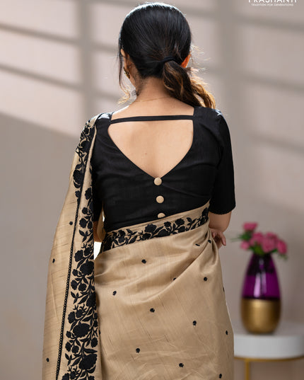 Art tussar saree beige and black with embroidery work and floral embroidery border