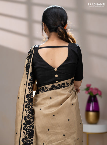 Art tussar saree beige and black with embroidery work and floral embroidery border