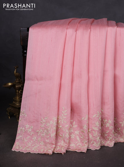 Art tussar saree peach shade with plain body and floral embroidery border