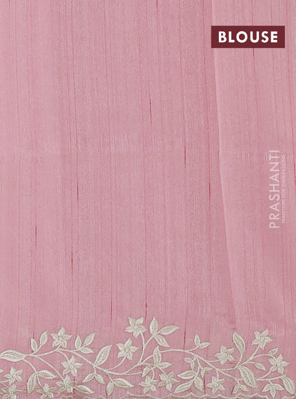 Art tussar saree peach shade with plain body and floral embroidery border