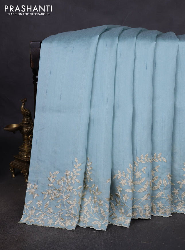 Art tussar saree patel blue with plain body and floral embroidery border