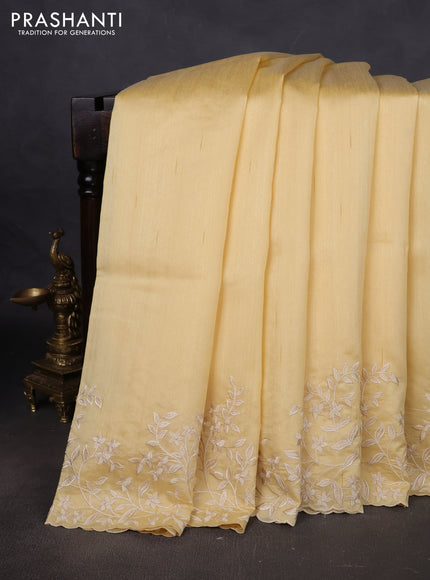 Art tussar saree pale yellow with plain body and floral embroidery border