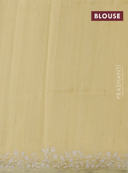 Art tussar saree pale yellow with plain body and floral embroidery border