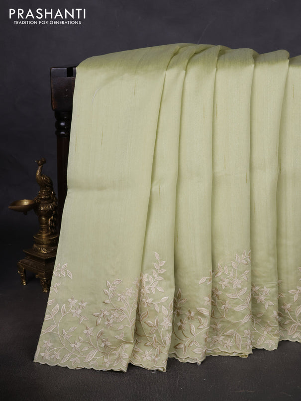 Art tussar saree mild pista green with plain body and floral embroidery border
