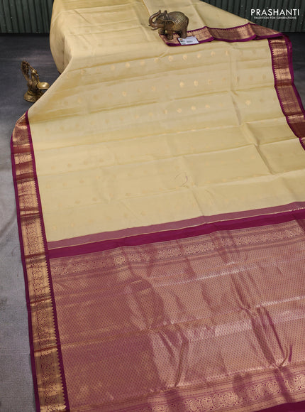 Pure kanchipuram silk saree beige and purple with zari woven buttas and zari woven korvai border