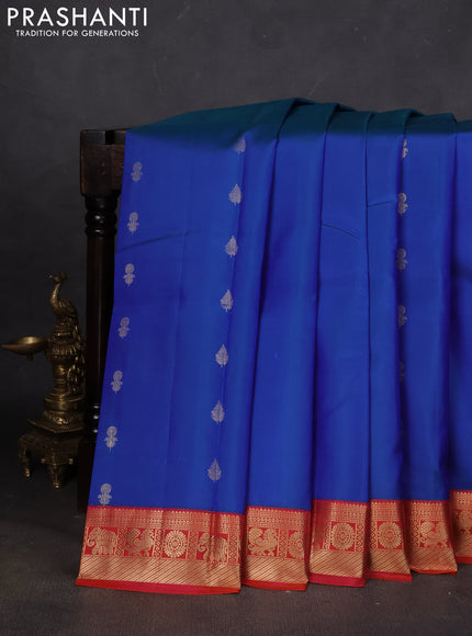 Pure kanchipuram silk saree cs blue and dual shade of pinkish orange with floral zari woven buttas and zari woven korvai border