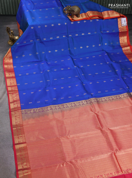 Pure kanchipuram silk saree cs blue and dual shade of pinkish orange with floral zari woven buttas and zari woven korvai border