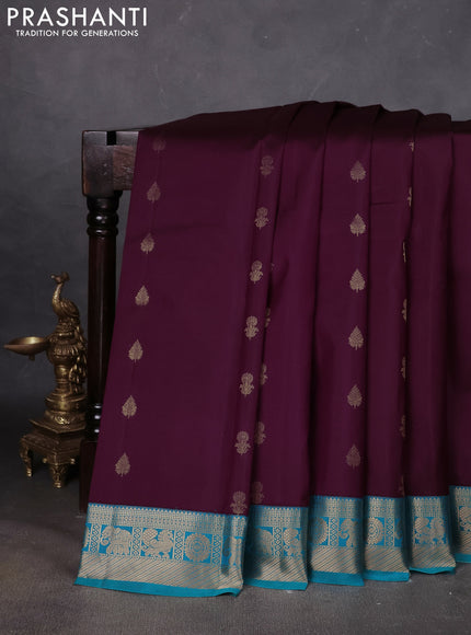 Pure kanchipuram silk saree deep wine and teal blue with floral zari woven buttas and zari woven korvai border