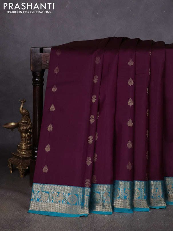 Pure kanchipuram silk saree deep wine and teal blue with floral zari woven buttas and zari woven korvai border
