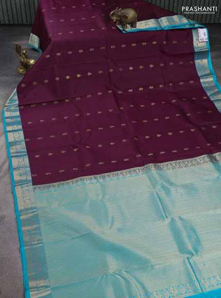 Pure kanchipuram silk saree deep wine and teal blue with floral zari woven buttas and zari woven korvai border