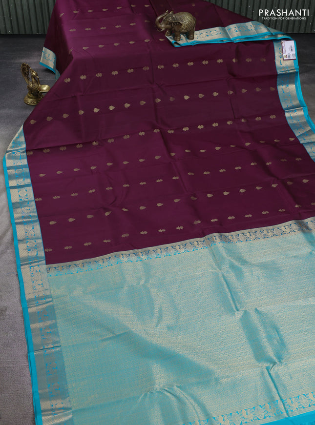 Pure kanchipuram silk saree deep wine and teal blue with floral zari woven buttas and zari woven korvai border