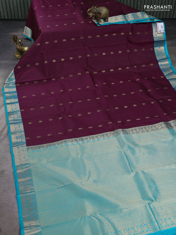 Pure kanchipuram silk saree deep wine and teal blue with floral zari woven buttas and zari woven korvai border