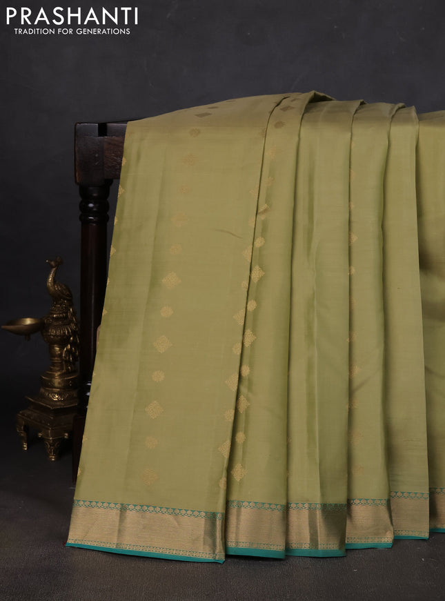 Pure kanchipuram silk saree pista green and teal blue with zari woven buttas and zari woven border