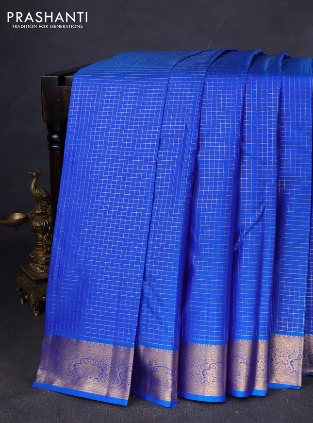 Pure kanchipuram silk saree cs blue with allover zari checked pattern and zari woven korvai border
