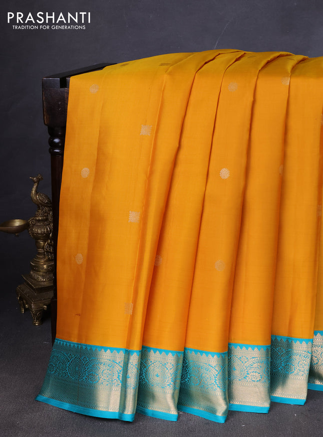 Pure kanchipuram silk saree mustard yellow and teal green with zari woven buttas and zari woven korvai border