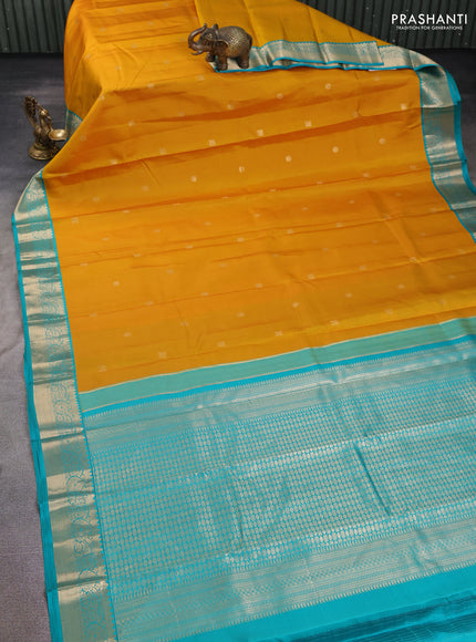 Pure kanchipuram silk saree mustard yellow and teal green with zari woven buttas and zari woven korvai border