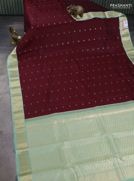 Pure kanchipuram silk saree deep maroon and pastel green with zari woven buttas and zari woven korvai border