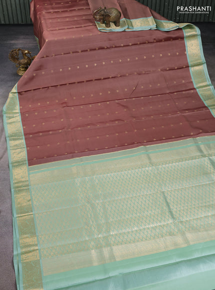 Pure kanchipuram silk saree brown and pastel green with zari woven buttas and zari woven korvai border