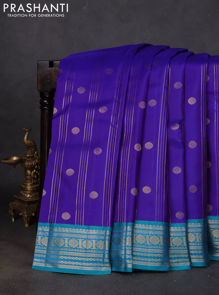 Pure kanchipuram silk saree royal blue and teal green with allover zari stripes & buttas and zari woven korvai border