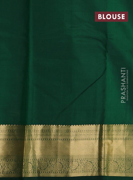 Pure kanchipuram silk saree bottle green with zari woven buttas and zari woven korvai border