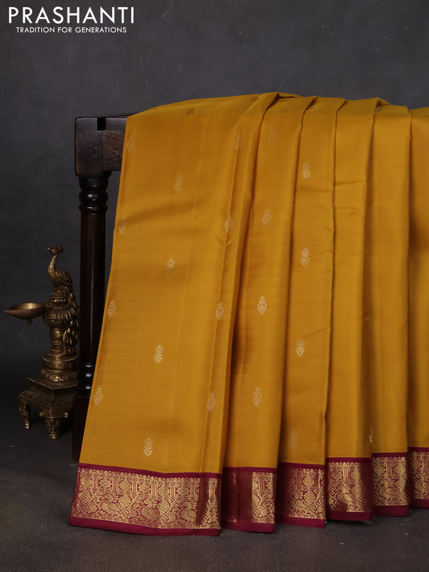 Pure kanchipuram silk saree yellow and wine shade with zari woven buttas and zari woven korvai border