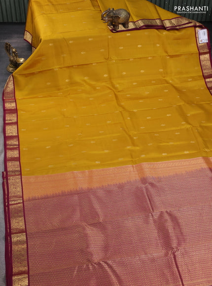 Pure kanchipuram silk saree yellow and wine shade with zari woven buttas and zari woven korvai border