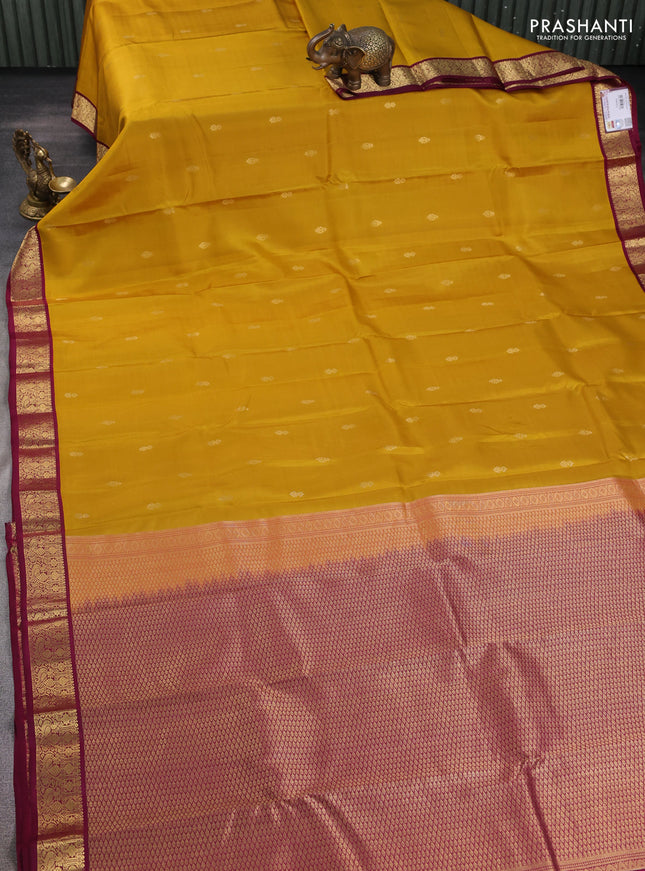 Pure kanchipuram silk saree yellow and wine shade with zari woven buttas and zari woven korvai border