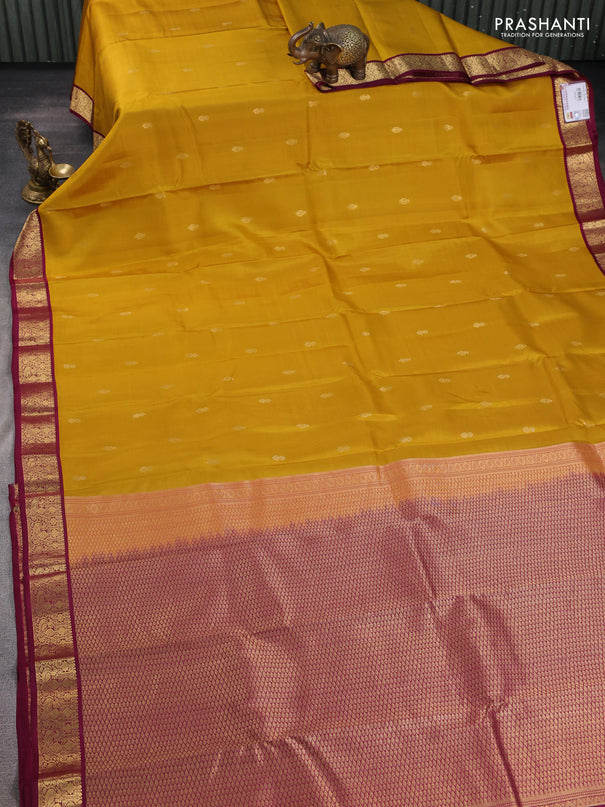 Pure kanchipuram silk saree yellow and wine shade with zari woven buttas and zari woven korvai border