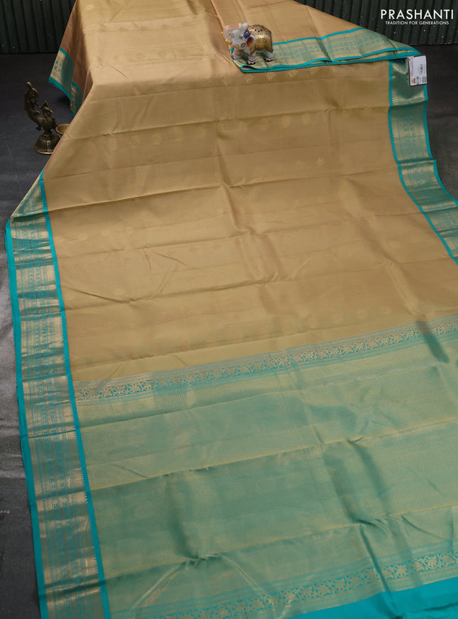 Pure kanchipuram silk saree sandal and teal green with zari woven buttas and zari woven korvai border