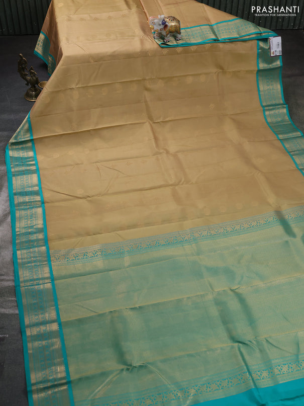 Pure kanchipuram silk saree sandal and teal green with zari woven buttas and zari woven korvai border