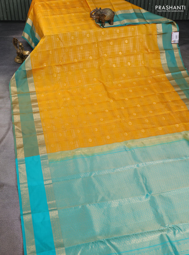Pure kanchipuram silk saree yellow and teal green with allover zari checks& buttas and rettapet zari woven border
