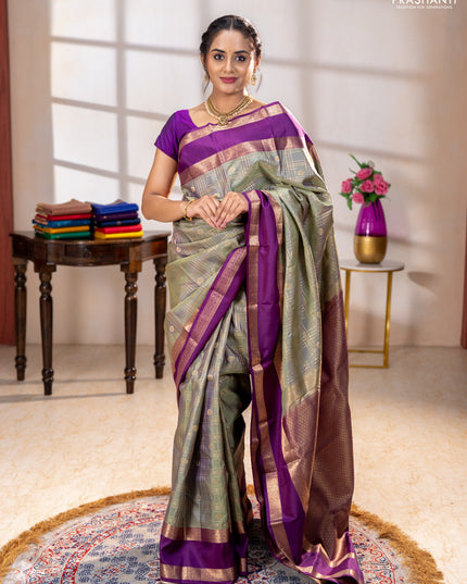 Pure kanchipuram silk saree pastel green and purple with allover zari checks& buttas and rettapet zari woven border