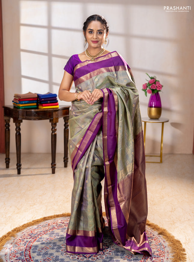 Pure kanchipuram silk saree pastel green and purple with allover zari checks& buttas and rettapet zari woven border