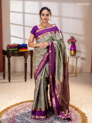 Pure kanchipuram silk saree pastel green and purple with allover zari checks& buttas and rettapet zari woven border