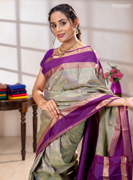 Pure kanchipuram silk saree pastel green and purple with allover zari checks& buttas and rettapet zari woven border
