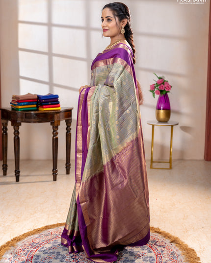 Pure kanchipuram silk saree pastel green and purple with allover zari checks& buttas and rettapet zari woven border