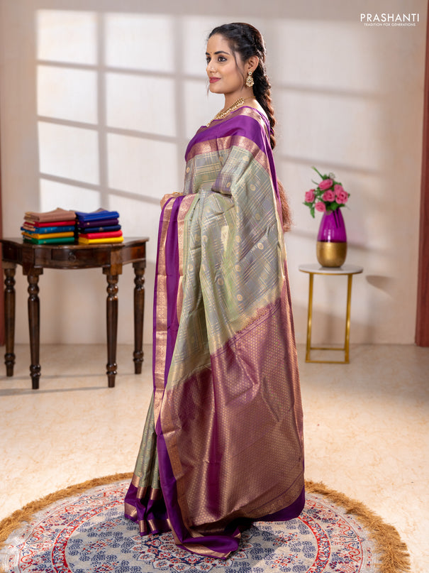 Pure kanchipuram silk saree pastel green and purple with allover zari checks& buttas and rettapet zari woven border