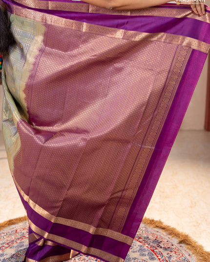Pure kanchipuram silk saree pastel green and purple with allover zari checks& buttas and rettapet zari woven border